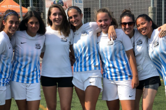 Smiling for the camera at the girls soccer camp in Barcelona