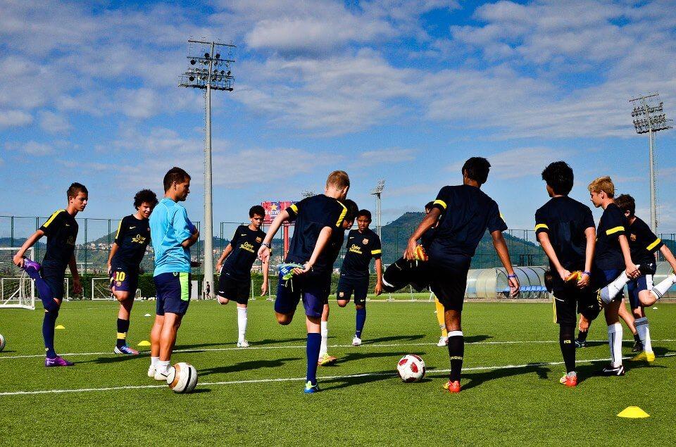 Coaching youth soccer doing static stretches