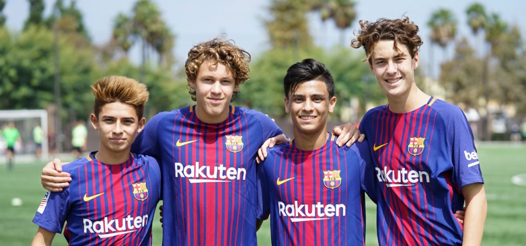 Happy youth soccer players smiling for the camera