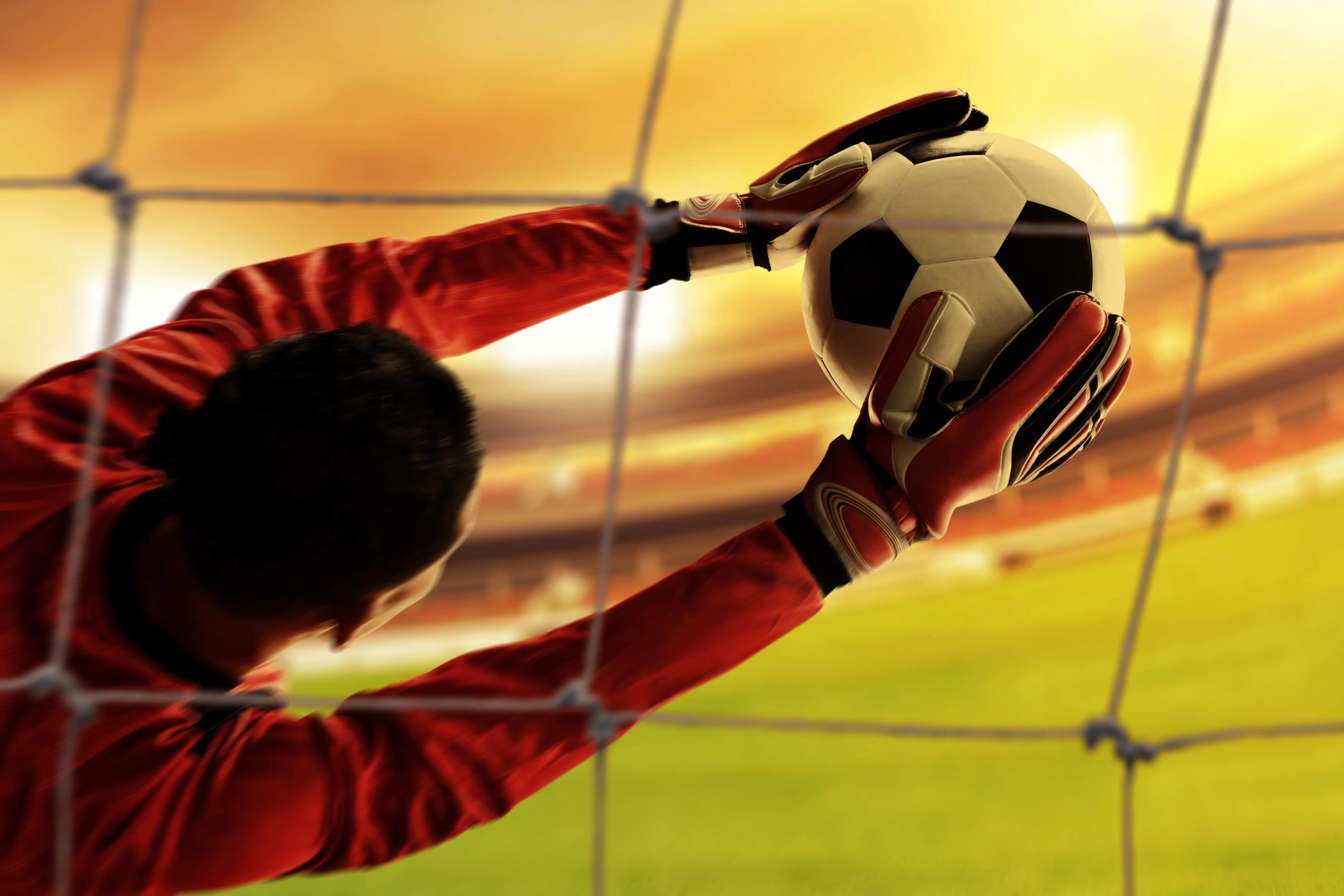 Goalkeeper at a football camp, where players train but no scouts attend
